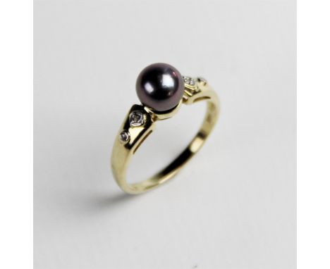 A Tahitian pearl and diamond 14ct gold dress ring, the round cultured pearl approx. 7mm diameter, with two eight cut diamonds