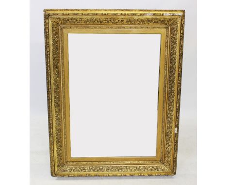 A 19th century and later gilt wood and gesso wall mirror, the later mirrored plate within a frame moulded with scrolling foli