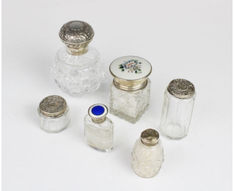 A selection of silver and white metal mounted dressing table jars, to include a cut glass, silver and enamel example by Herbe