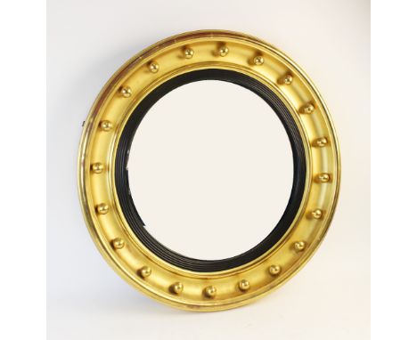 A Regency style giltwood convex circular wall mirror, 59cm diameter overall 