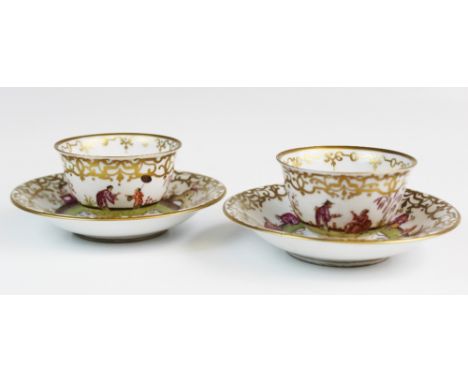 A pair of hard paste porcelain tea bowls and saucers, decorated in the manner of Johann Gregorius Horoldt, each decorated in 