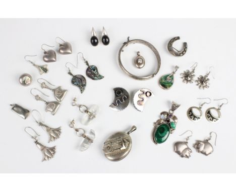 A selection of Victorian and later silver and white metal jewellery, to include a Victorian white metal locket pendant with b