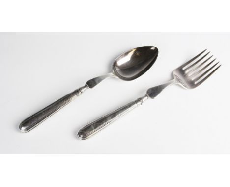 A matched George III silver serving fork and spoon, each with lion crest engraved to weighted handles, marks to fork blade fo