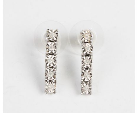 A pair of diamond drop earrings, comprising five round illusion cut diamonds, each illusion set to a 9ct white gold surround,