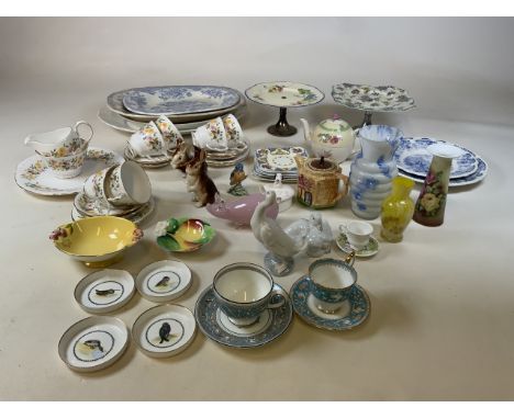 A collection of ceramics and collectibles to include a part Colclough tea set, two cake stands, blue and white, meat platters