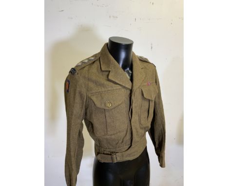 A vintage 1952 Captains military battle dress blouse from the Royal Army Education Corps in khaki serge size 7, 35-36 inch ch