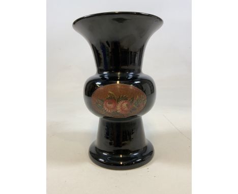 A black ceramic vase with floral decoration.W:21cm x D:21cm x H:32cm