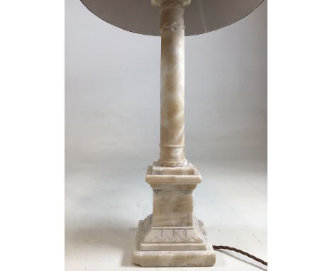 A marble lamp base. Wear commensurate with age. H:45cm