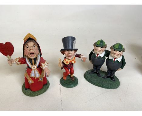 A collection of three Goebel of Alice  in Wonderland resin figurines including The Mad Hatter, The Queen of Hearts and Tweedl