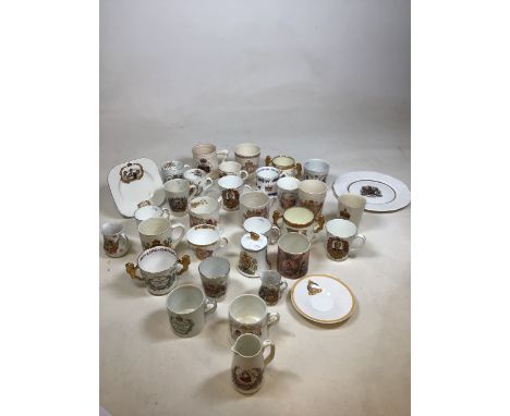 A collection of ceramic royal commemorative ware including mugs, plates and other items 