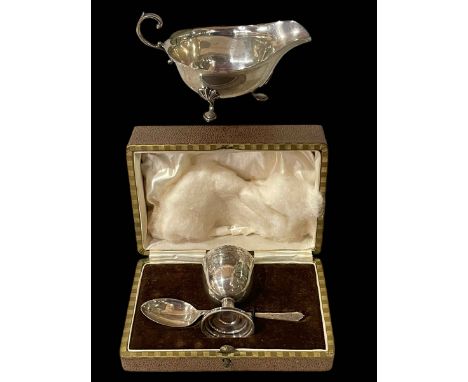 Silver sauce boat, Birmingham 1913 and cased silver egg cup and spoon, Sheffield 1928.