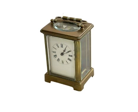 Gilt brass carriage clock with key.
