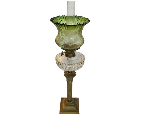 Vintage brass columned oil lamp with green shade, 74cm.