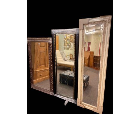 Black and gilt framed rectangular wall mirror, 158cm by 64cm, bronze coloured framed rectangular bevelled wall mirror, 142cm 