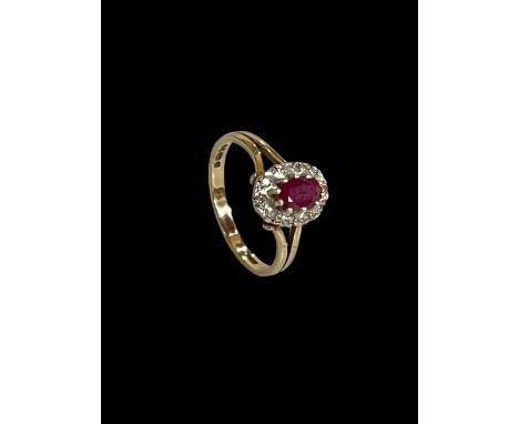 Ruby and diamond 9 carat gold ring, size O.