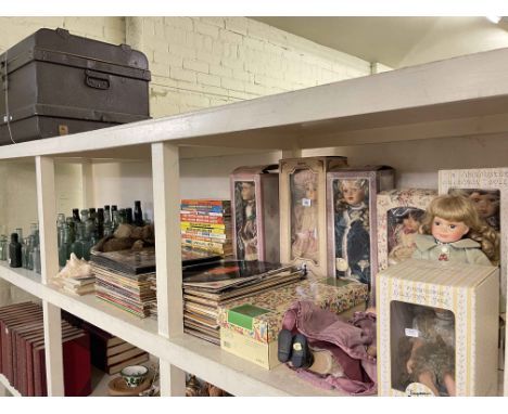 Various dolls, LP records, children's annuals, glass bottles, tin trunk, etc.