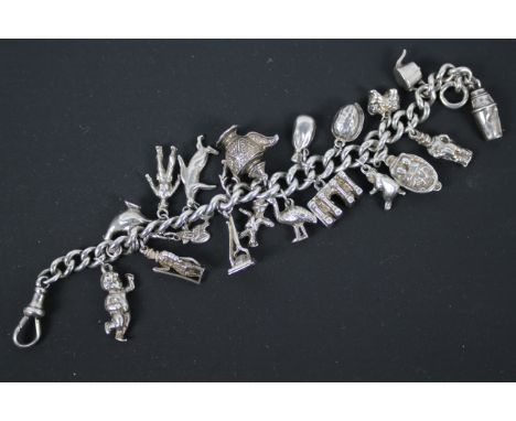A silver charm bracelet, 19 cm (l), with 19 various charms, approximately 71 grams