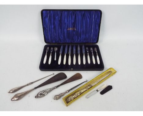 An Edwardian silver and mother of pearl flatware set in case, (one fork a plated replacement), Sheffield assay 1903, sponsors
