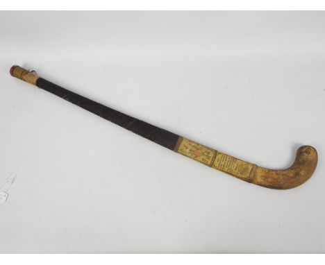 A vintage Springbok New Model hockey stick c.1939 with paper label bearing facsimile signatures of the 1938 Indian Olympic ho