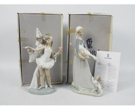Lladro - Two boxed figural groups comprising # 4882 Carnival Couple and # 4866 Girl With Goose And Dog, largest approximately
