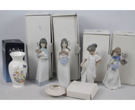 Four boxed Nao figures of children, an Aynsley vase (also boxed) and similar, largest approximately 20 cm (h).