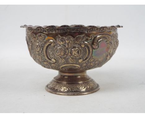 A late Victorian silver rose bowl decorated with repousse floral scrolls, London assay 1900, sponsors mark for Wakely &amp; W