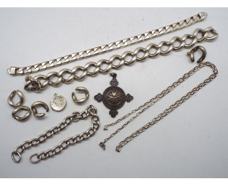 A collection of silver and white metal jewellery to include bracelets (A/F), locket pendant, St John Ambulance medallion and 
