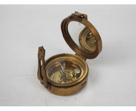 A brass cased, Stanley London, nautical compass with natural sine table to the casing