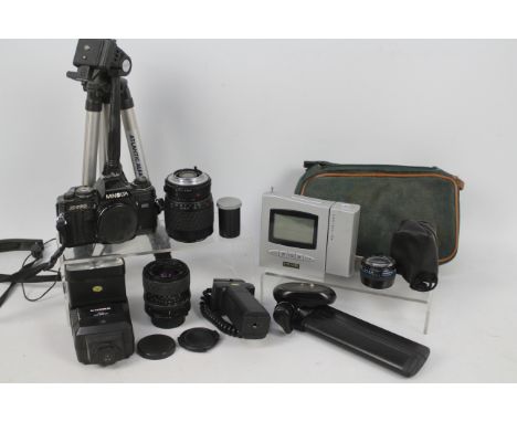 Photography - A Minolta X-700 camera, lenses and further accessories.