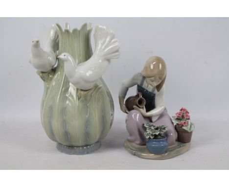 A Lladro figure, # 1376 depicting a girl watering flowers and a further piece of Spanish porcelain, a vase with applied doves