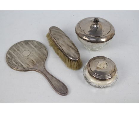 A collection of silver mounted dressing table items, various assay marks