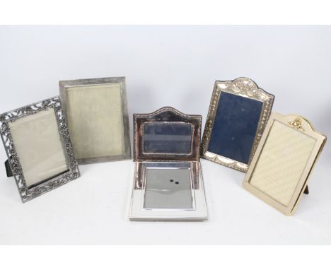 Six easel back photograph frames three of which are silver mounted, largest approximately 24 cm x 17 cm