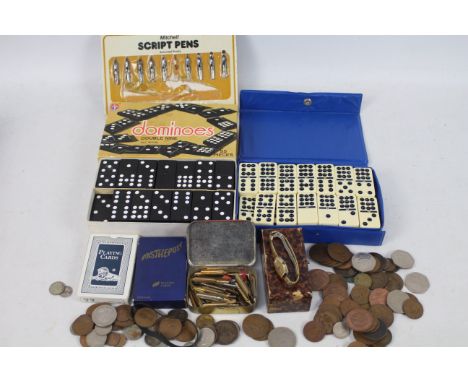 Lot to include a vintage wrist watch, two sets of double nine dominoes, playing cards, pen nibs, a quantity of coins, Victori