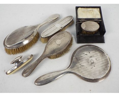 A collection of silver mounted dressing table items, various assay marks