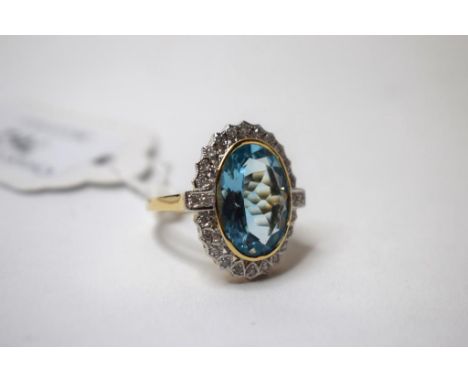 A large oval blue topaz and diamond ring, in a 9ct gold mount, approx. ring size L  Condition report Modern