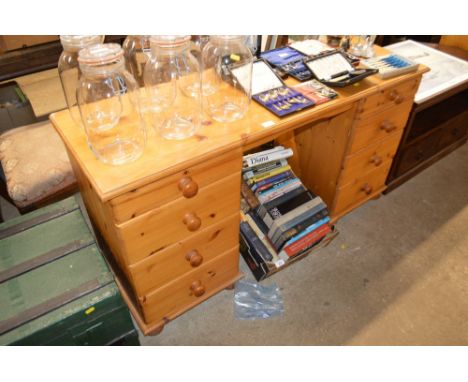 A modern pine dressing table fitted 8 drawers