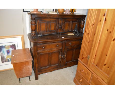 An Ercol court cupboard
