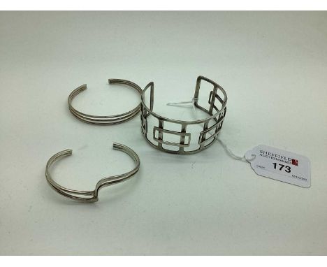 A Wide Modernist Style Openwork Cuff Bangle, of geometric design; together with two smaller bangles. (3) [576173]