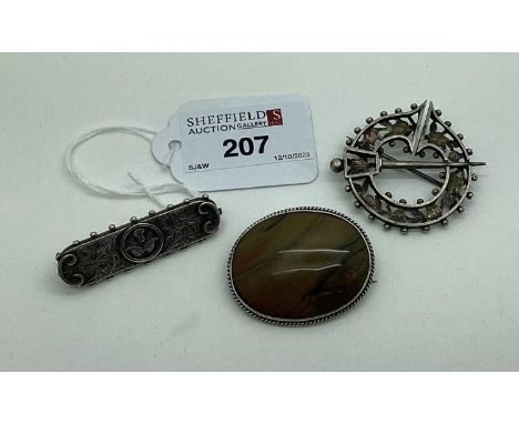 A Vintage Penannular Brooch, of openwork design; together with a polished oval hardstone brooch and a Victorian brooch with e