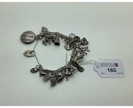 A Curb Link Charm Bracelet, to a hallmarked silver heart shape padlock style clasp, suspending numerous assorted novelty char