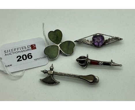 A Polished Hardstone Inset Shamrock Brooch, stamped "Silver"; together with a hardstone inset axe brooch, an amethyst heart s