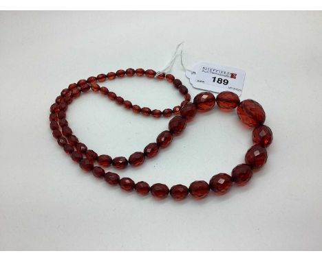 A Vintage Cherry Amber Coloured Graduated Faceted Bead Necklace. [620118]The necklace weighs 33grams.