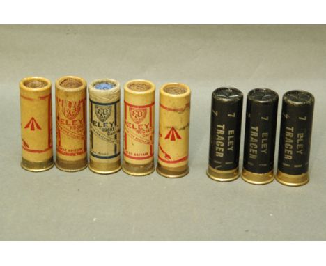8 paper cased 12 bore cartridges, Eley Tracer No. 7 shot, Eley Rocket (4 stamped with broad arrow). 