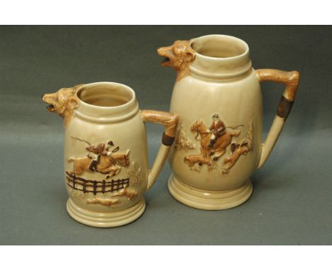 Pair of fox hunting jugs.  Heights 20 cm and 16 cm. 