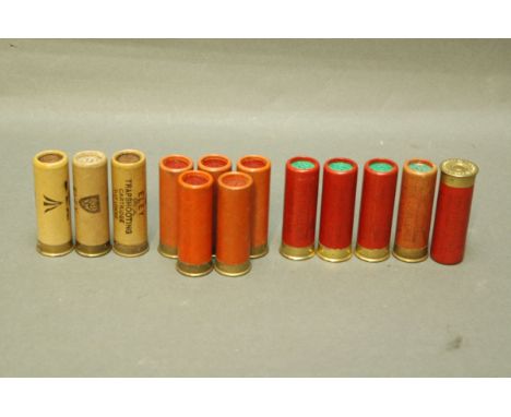 13 12 bore paper cased cartridges, Eley Special Trap Shooting stamped with broad arrow, Pneumatic Cartridge Co. and Jas R. Wa