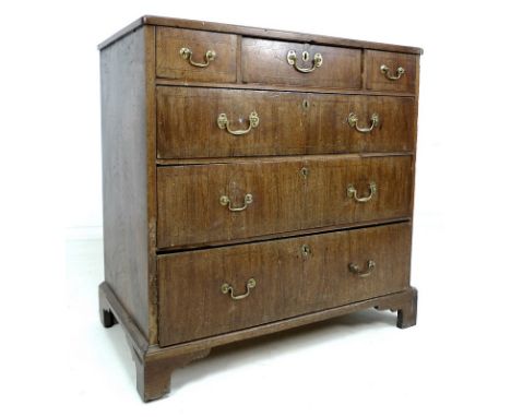 A George III mahogany and line inlaid chest of three narrow over three long graduating drawers, brass swan neck handles and e