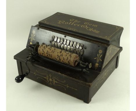 A late 19th century Victorian 'Gem Roller Organ', black and gilt painted with hand wind mechanism, 30.5 by 36.5 by 19.5cm, wi