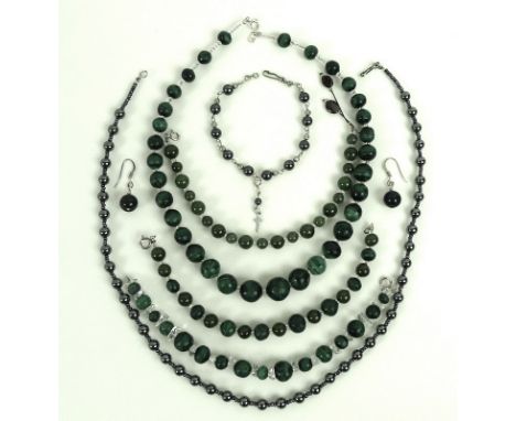 A collection of costume jewellery, comprising a spinach jade bead bracelet, interspersed with clear glass bead spacers, 18.5c