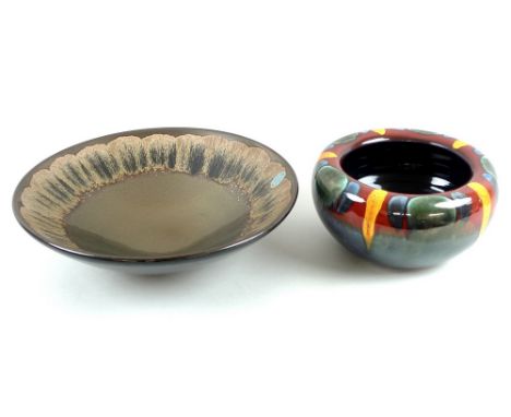 A Poole pottery bowl, finished in copper and brown lustre, 35 by 10cm, together with a Poole pottery cachepot, decorated poly