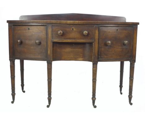 A Regency mahogany bow fronted sideboard server, four drawers with cock beading and turned handles, raised on ring turned leg